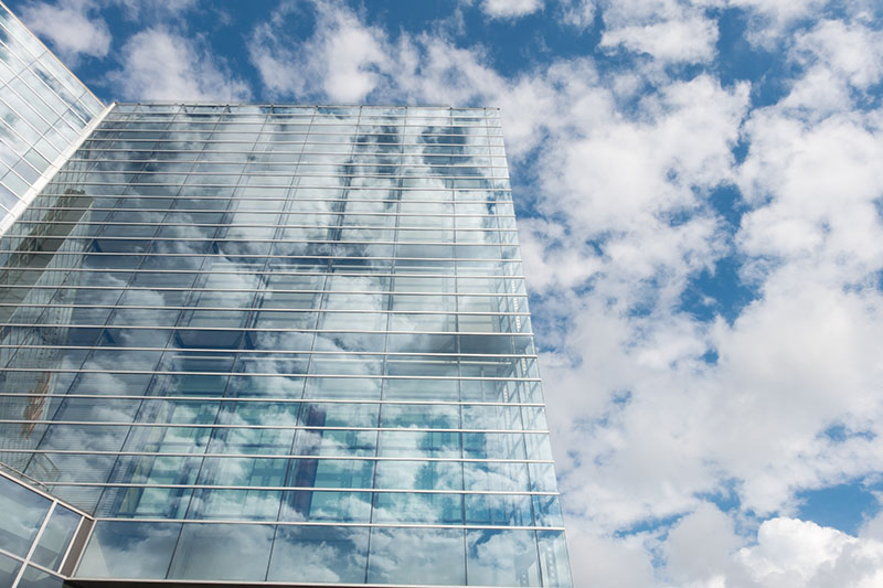 Bottom View Of Clear Glass Building Under Blue Cloudy Sky 800 X 533 Px